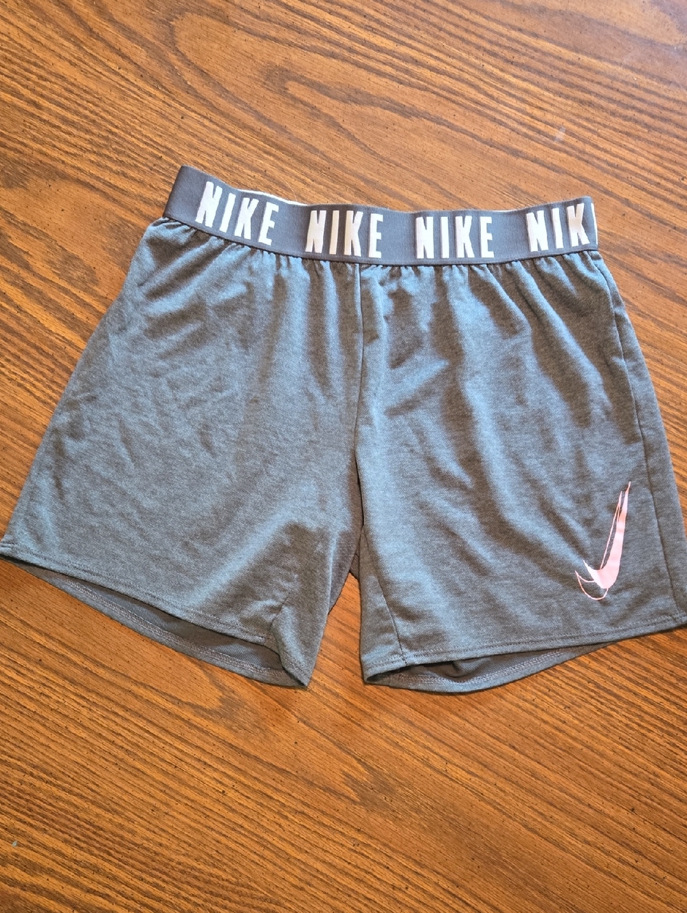 Nike Women’s Gray Athletic Shorts with Pink Swoosh